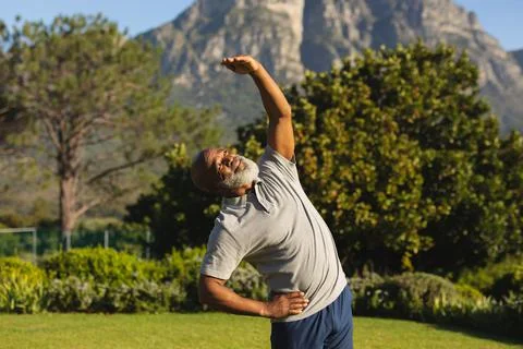 Senior african american man exercising outdoors in stunning countryside Stock Photos
