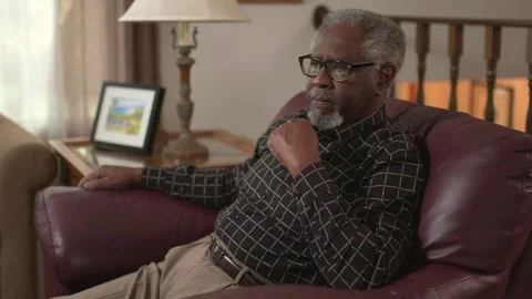A senior African American man is sad, stressed and thinking Stock Footage
