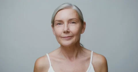 A senior age model without makeup posing looking at the camera Stock Footage 168054209