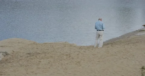 Senior Aged Man Man's Back at The River Lake Father Grandfather at Sandy Bank Stock Footage 54805387
