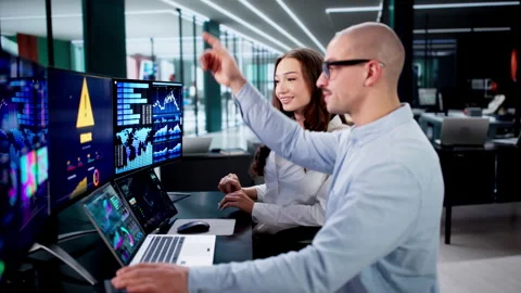 Senior Analyst Helping Colleagues With Error On Screen Stock Footage 326057925