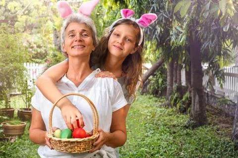 Senior and child with Easter basket Stock Photos