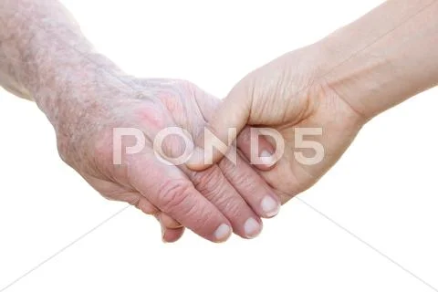 Senior and young holding hands Stock Photos