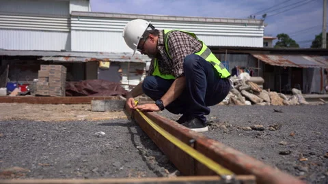 Senior architect or civil engineer using tape measure measuring to inspecti.. Stock Footage 262154281