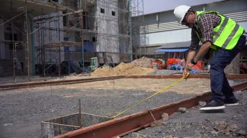 Senior architect or civil engineer using tape measure measuring to inspecti.. Stock Footage 262154351