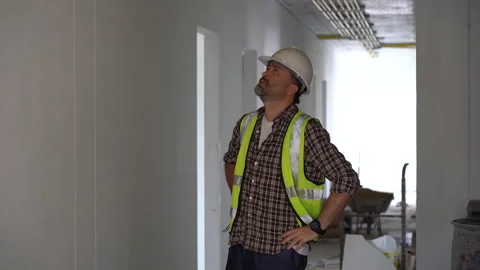 Senior architect or civil engineer using tape measure measuring to inspecti.. Stock Footage 262155079