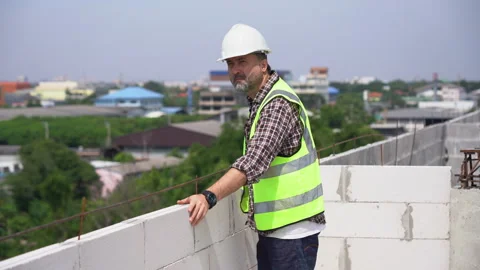 Senior architect or civil engineer  inspection and control on rooftop at co.. Stock Footage 262156316