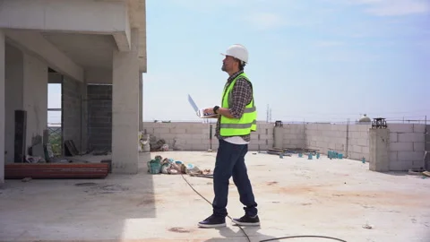 Senior architect or civil engineer using laptop computer inspection rooftop.. Stock Footage 262156799