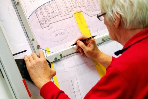 Senior architect working on drawing board Stock Photos