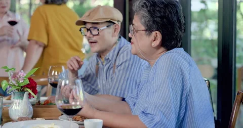 Senior asian man and elderly asian woman dining together during restaurant Stock-Footage 343831994