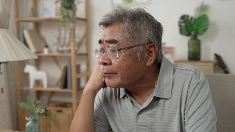 Senior asian man deep in thought Stock Footage 165755525