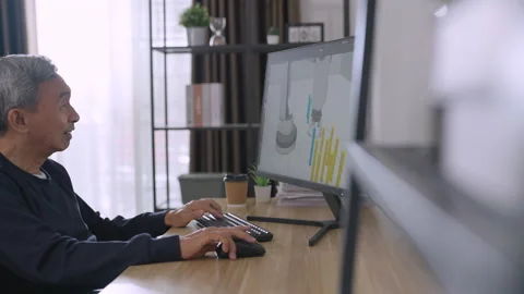 Senior asian man design robot arm at home. Stock Footage 220451833