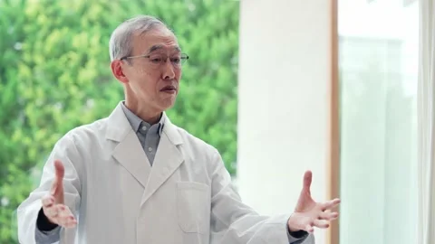 Senior Asian man explaining something. Scientist. Professor. Video stock 166372002