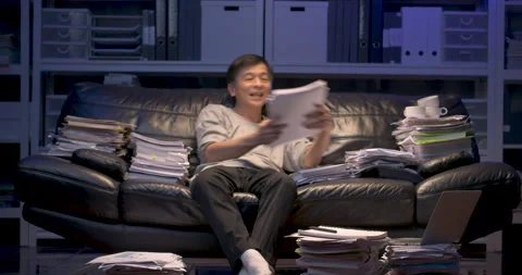 Senior asian man working on sofa, analyzing data, using laptop and sleeping. Stock Footage 139822341