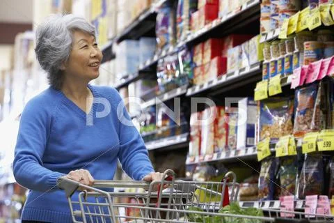Senior Asian Woman Shopping In Grocery Store