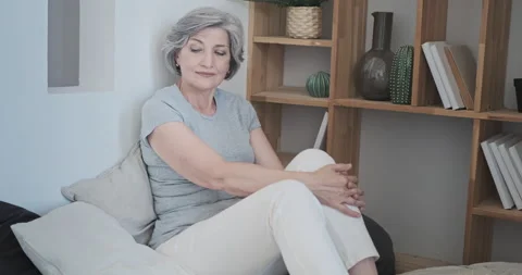 Senior attractive lady lying back on comfortable podium, happy mature elderly Stock Footage 159171693