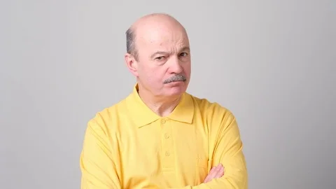 Senior bald man showing refusal gesture, shaking his head Stock Footage 102803797