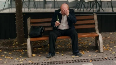 Senior bald worker drinking alcohol after work showing addiction issue Stock Footage 318879554