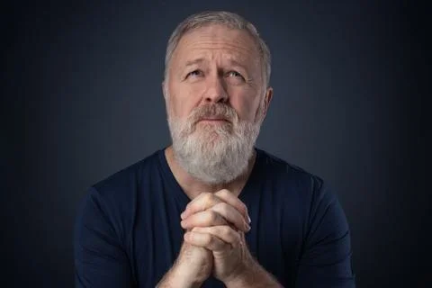 Senior with beard praying Stock Photos
