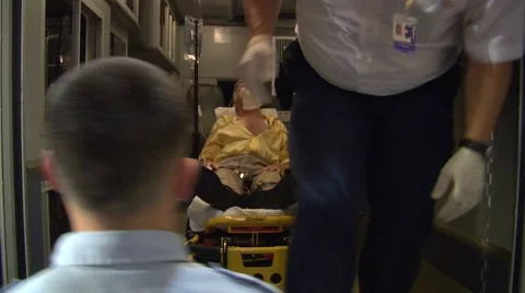 Senior being pulled out of ambulance. Stock Footage 965950