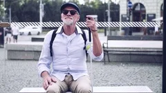 Senior blind man with white cane waiting, Stock Video