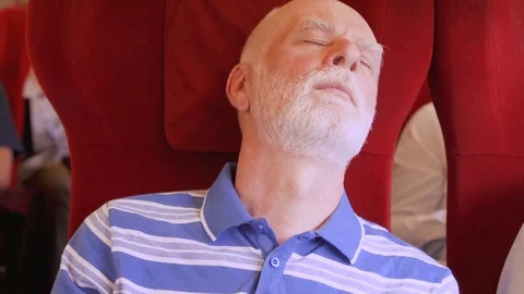 Senior bold man sleeping in high-speed international train. Very high speed Stock Footage 82045049