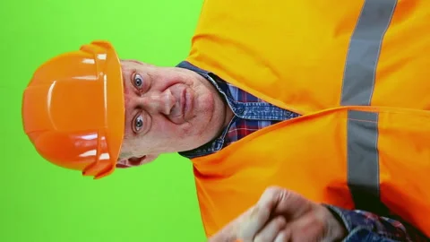 Senior builder in hardhat refuses to work, waves hands and shows thumbs down. Stock Footage 252293918