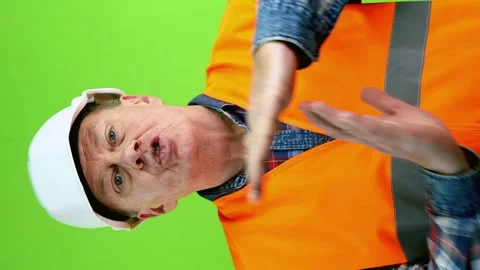 Senior builder in hardhat showing timeout symbol and calls everyone with gesture Stock Footage 252293496