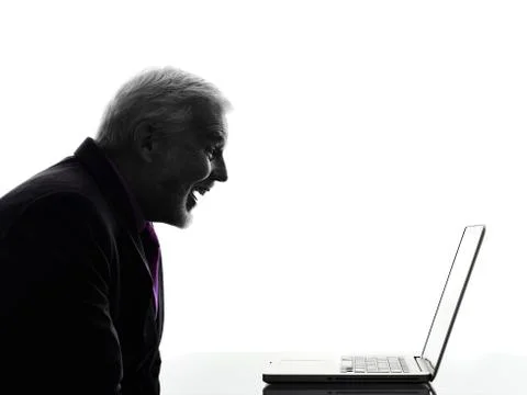 Senior business man smiling computing laptop silhouette Fotos Stock
