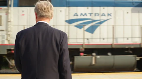 Senior Business Waiting on Platform while Train Arrives Stock Footage 32233691