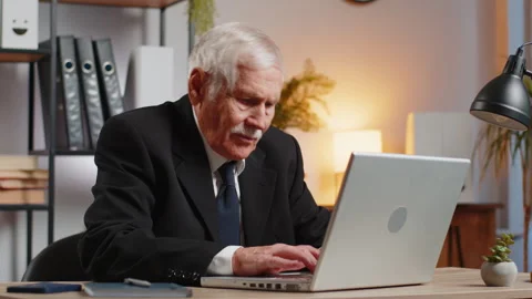 Senior businessman having software problems with laptop seeing error Stock Footage 293855522