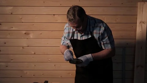 Senior carpenter preparing to work Stock Footage 77109418