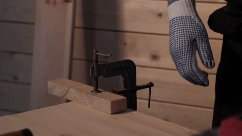 Senior carpenter sawing board Stock Footage 77109216