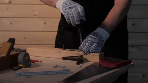 Senior carpenter tighten the screw Stock Footage 77109384