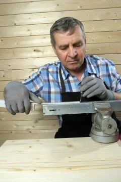 Senior carpenter working in his workshop Stock Photos