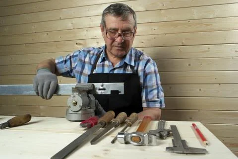 Senior carpenter working in his workshop Stock Photos