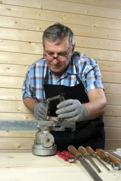 Senior carpenter working in his workshop Stock Photos