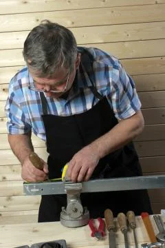 Senior carpenter working in his workshop Stock Photos