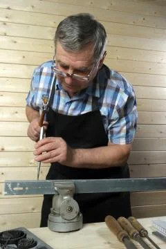 Senior carpenter working in his workshop Stock Photos