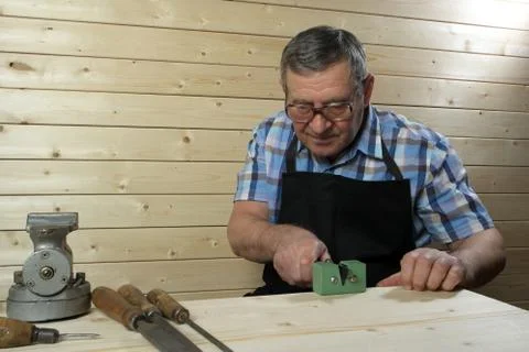 Senior carpenter working in his workshop Stock Photos