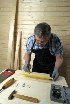 Senior carpenter working in his workshop Stock Photos
