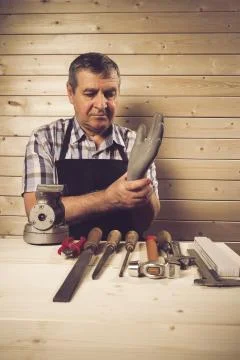 Senior carpenter working in his workshop Stock Photos