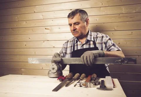 Senior carpenter working in his workshop Stock Photos