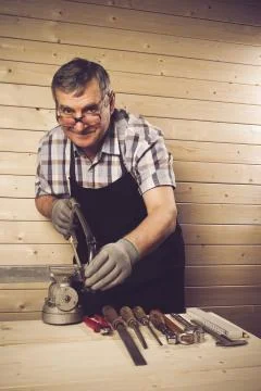 Senior carpenter working in his workshop Stock Photos