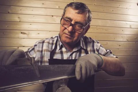 Senior carpenter working in his workshop Stock Photos