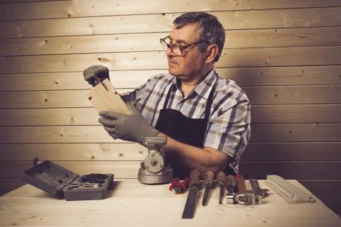 Senior carpenter working in his workshop Stock Photos