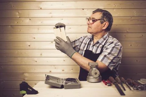 Senior carpenter working in his workshop Stock Photos