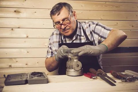 Senior carpenter working in his workshop Stock Photos
