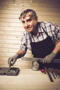 Senior carpenter working in his workshop Stock Photos