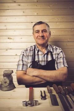 Senior carpenter working in his workshop Stock Photos